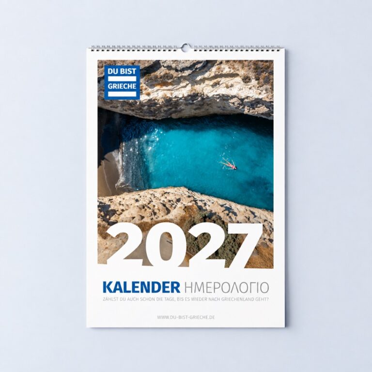 Wandkalender DU BIST GRIECHE 2027, das Titelblatt zeigt eine türkisblaue Felsbucht